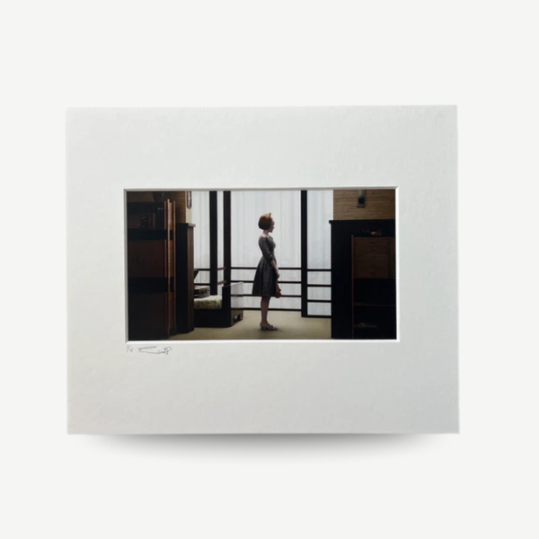 Framed photograph of a person standing in a room with a white border Erwin Olaf - Victoria from the 'Grief' series