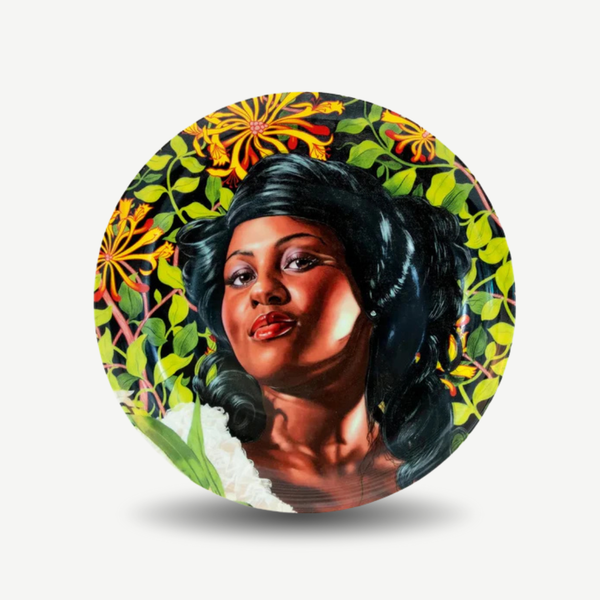 Decorative plate with a colorful design of a woman's face and floral patterns on a white background. Kehinde Wiley - Mary Little Plate