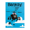 Book cover of 'Building Castles in the Sky' by Banksy with a helicopter and cloud design on a blue background.