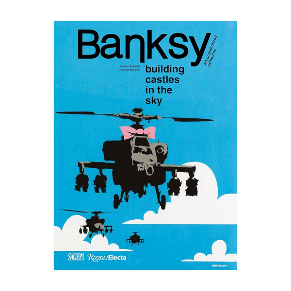 Book cover of 'Building Castles in the Sky' by Banksy with a helicopter and cloud design on a blue background.