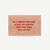 Original wood art tile by Jenny Holzer featuring red printed text, available for sale