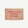 Original wood art tile by Jenny Holzer featuring red printed text, available for sale