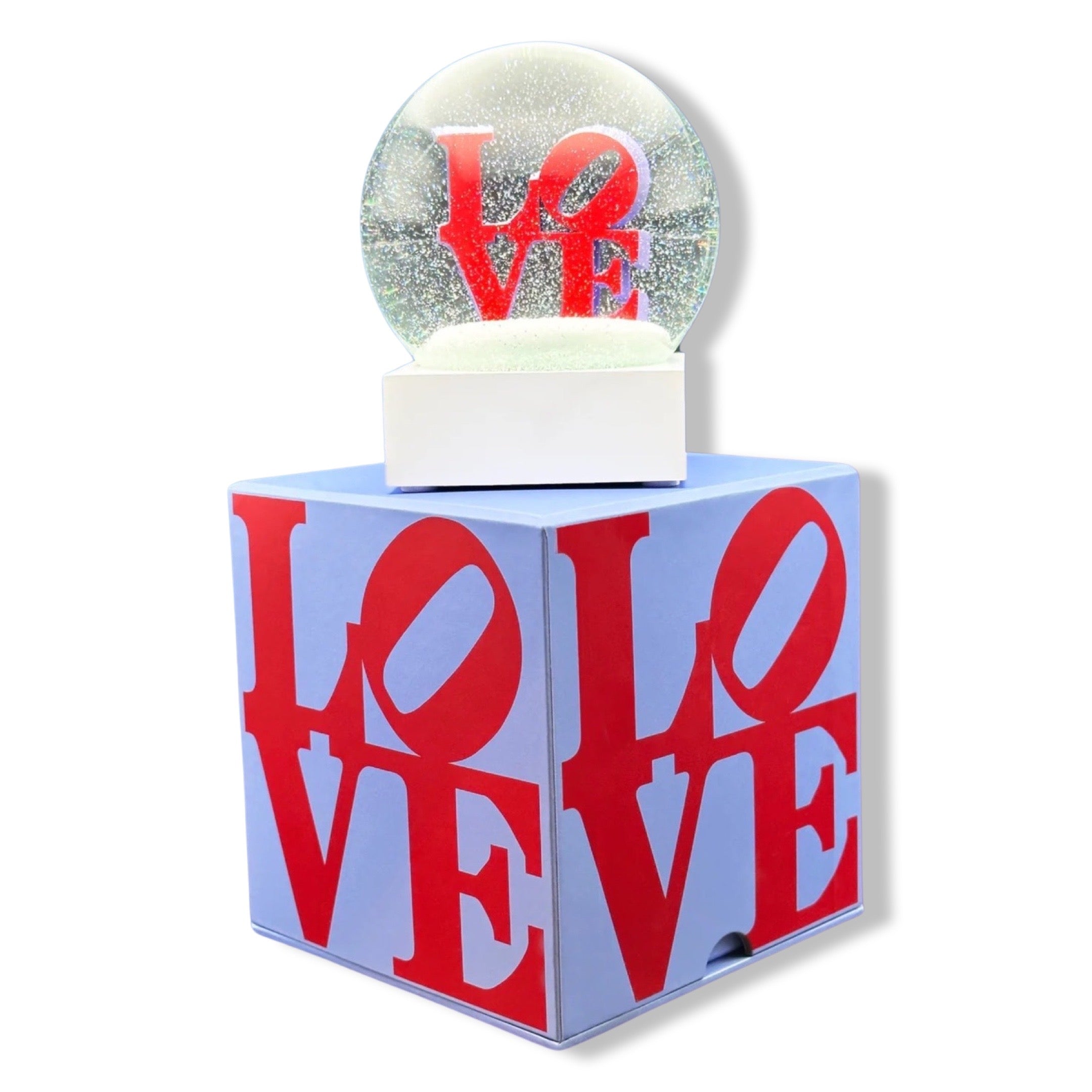 Snow globe with 'LOVE' text in red on a white background. Love by Robert Indiana official sculpture certified by the Morgan Art Foundation. Robert Indiana Collectible.