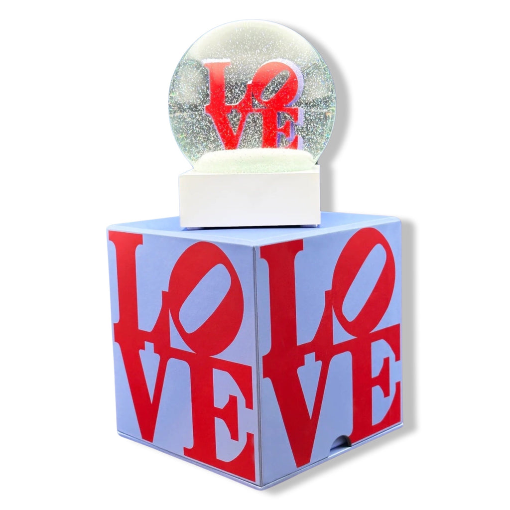 Snow globe with 'LOVE' text in red on a white background. Love by Robert Indiana official sculpture certified by the Morgan Art Foundation. Robert Indiana Collectible.