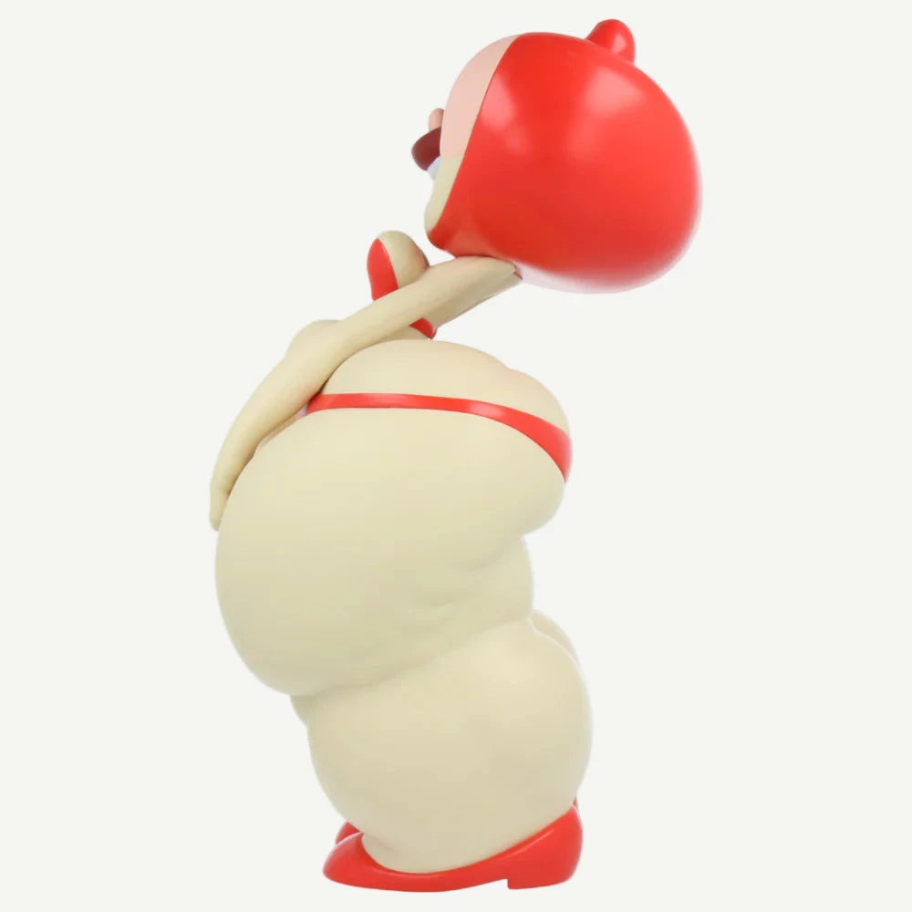 Toy figure of a character with red and beige colors on a white background