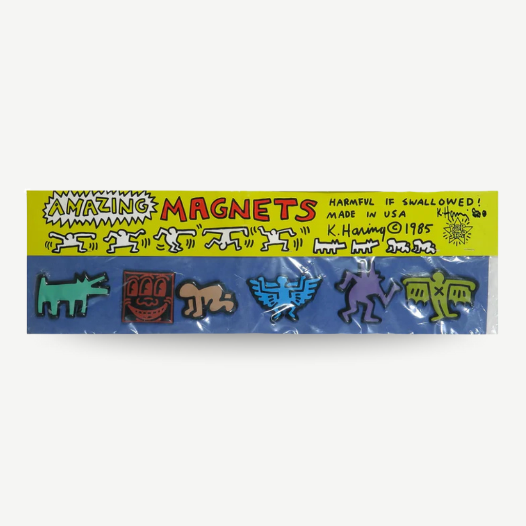 Packaged set of colorful magnets with a 'Keith Haring' design on a white background