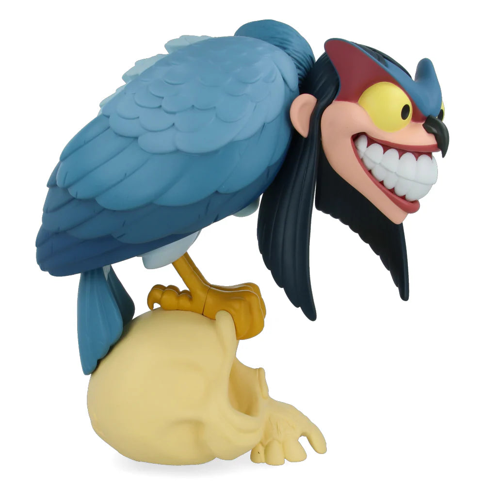 Animated character figurine with blue feathers and a yellow beak on a white background Standing 30cm tall and limited/numbered to 200 pieces;, this “blue” version of Peter de Seves' Harpy comes with two pairs of interchangeable, magnetic wings.