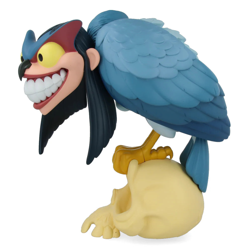 Toy figure of a blue bird with a red head and yellow beak on a white background Standing 30cm tall and limited/numbered to 200 pieces;, this “blue” version of Peter de Seves' Harpy comes with two pairs of interchangeable, magnetic wings.