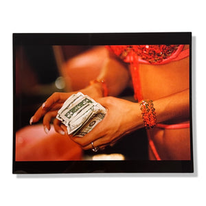 Lauren Greenfield - A stripper counts her money after a performance at Cheetahs club, Las Vegas
